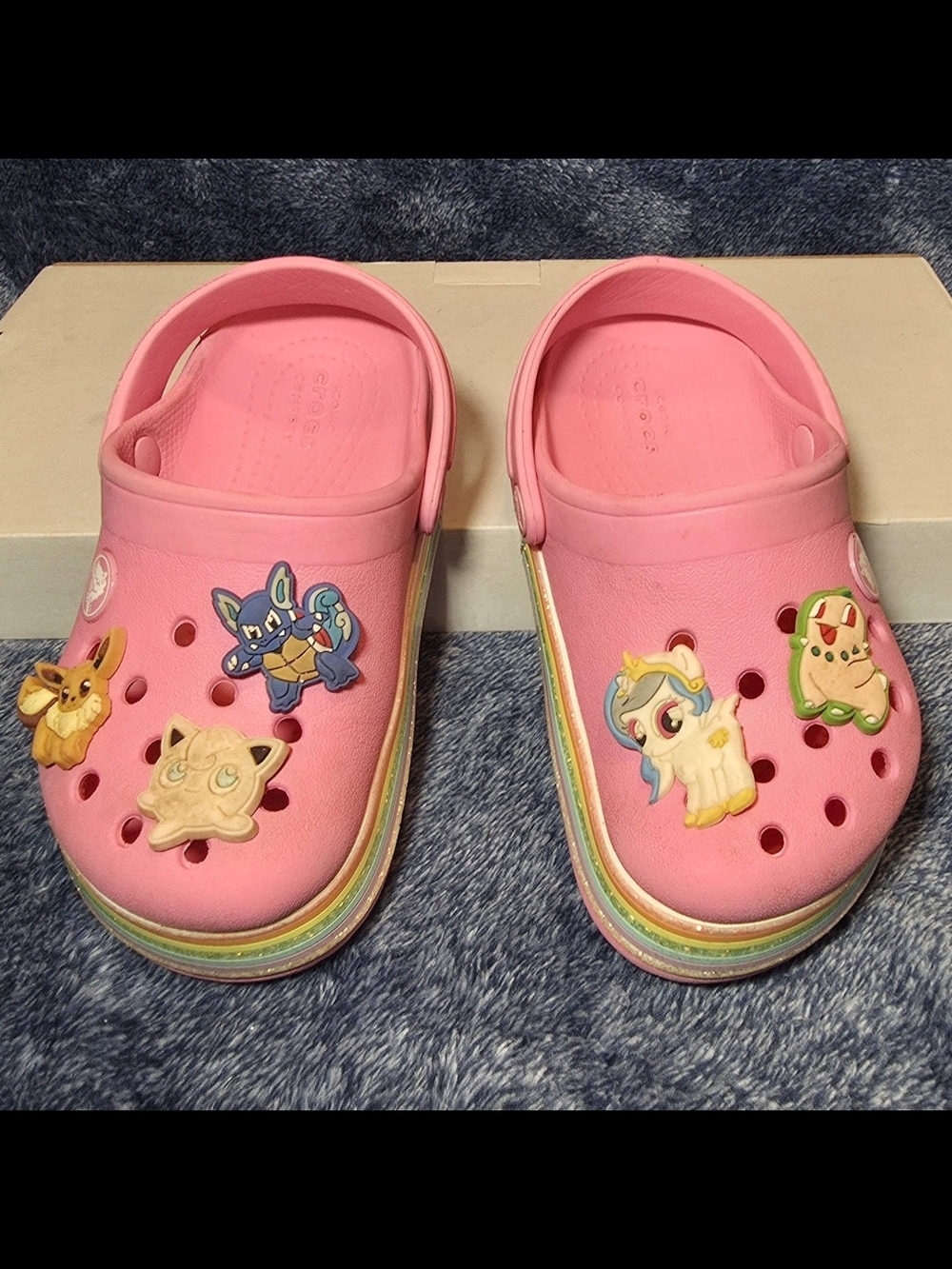 CROCS Kids Pink Clogs with Rainbow-Striped Midsoles with Pokemon Jibbitz